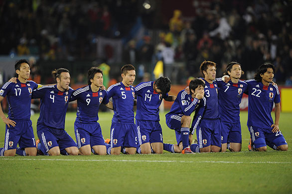 Paraguay v Japan: Japan players kneel and pray as Cardozo steps up to take the final penalty