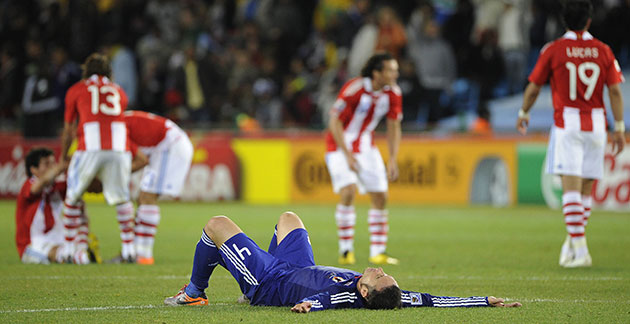 Paraguay v Japan: An exhausted Tulio collapses to the floor after extra time