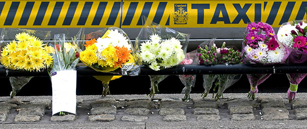Cumbria shootings: Floral tributes at a taxi rank on Duke Street in Whitehaven