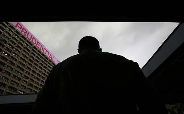 Week in Business: An advertisement for Prudential on top of a building in Hong Kong.
