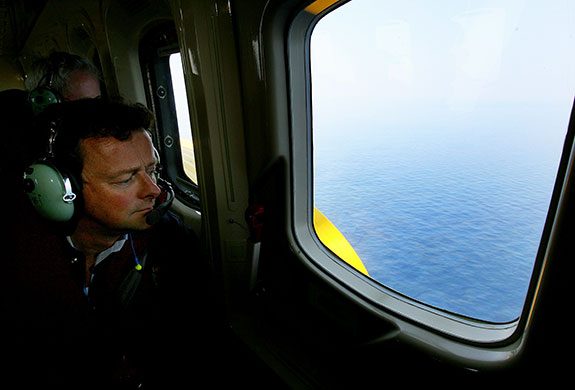 Week in Business: BP CEO Tony Hayward looks out of a helicopter window