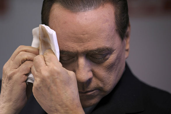 24 hours in pictures: Italy's prime minister Silvio Berlusconi