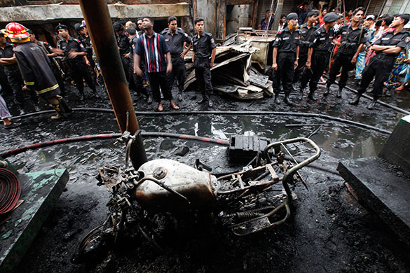 Dhaka fire: Members of the Rapid Action Battalion at the site of a fire in Dhaka
