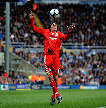 Rafa's flops: Liverpool's Alberto Aquilani attempts to control the ball