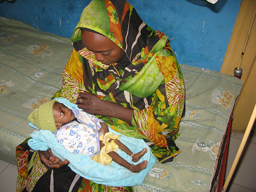 Kids for Kids: A mother holds her malnourished child