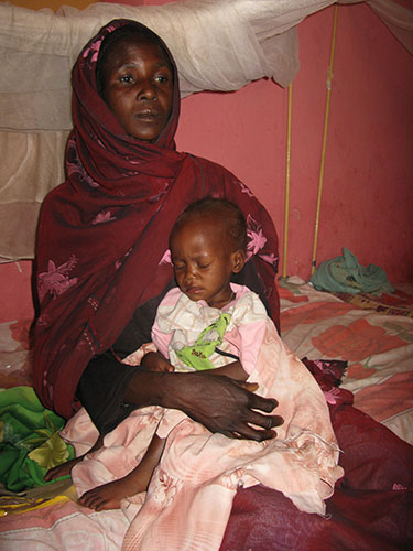 Kids for Kids: A mother holds her malnourished child