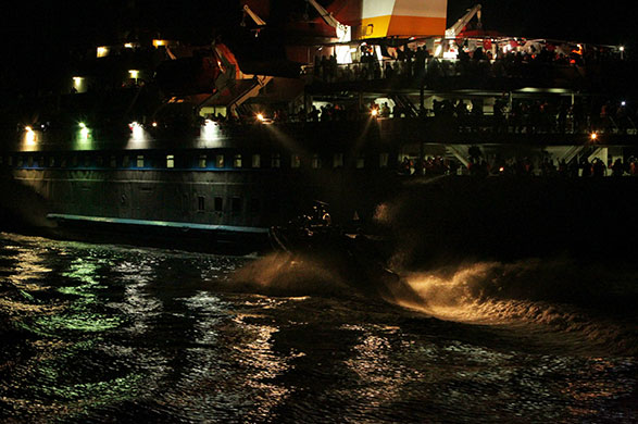 Mavi Marmara interception: An Israeli assault vessel heads towards the Turkish passenger ship