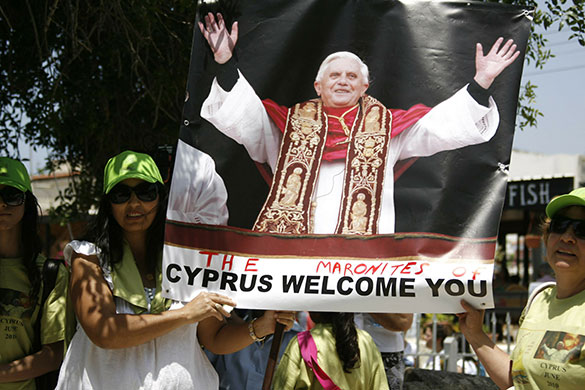 Pope in Cyprus: Cypriot Maronites hold a poster of Pope Benedict XVI
