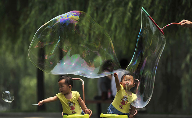 24 hours in pics: Children play with soap bubbles