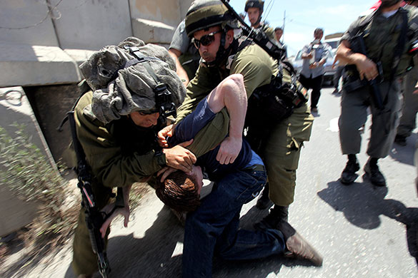 24 hours: Beit Omar, West Bank: Israeli soldiers detain an activist 