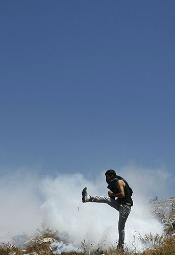 24 hours: A Palestinian demonstrator in Iraq Burin, West Bank