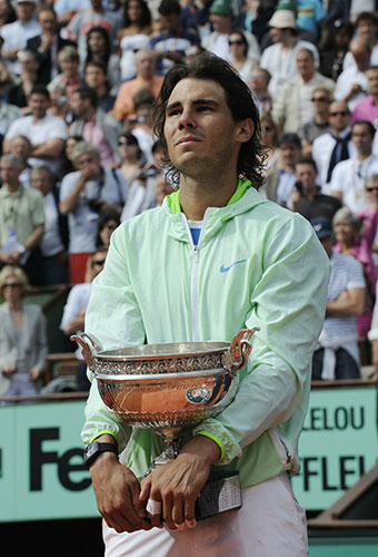 french open final 2010: Rafael Nadal holds the winners trophy