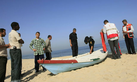 Police inspect a boat on the beach in Gaza