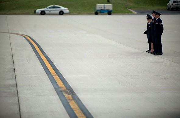 24 hours in pictures: Camp Springs, US: Military personnel stand by at Andrews air force base