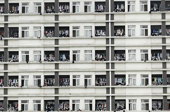 24 hours in pictures: Suzhou, China: Clothes hang from windows at a dormitory for workers