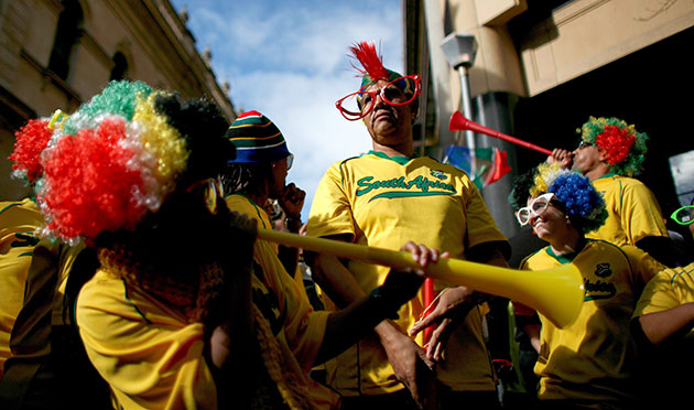 World Cup parade: Fans blow their traditional Vuvuzela horns in support of the national team
