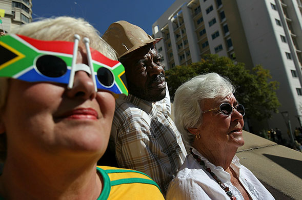 World Cup parade: South African fans wait to catch a glimpse of their national team