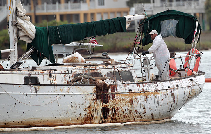 Hurricane Alex: An oily sailboat heads out on a skimming mission in the Perdido Pass