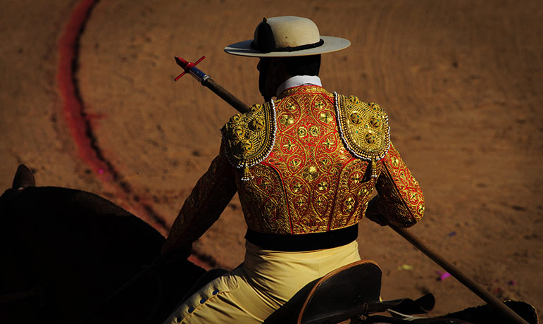 24 Hours: A picador rides his horse during the bullfight of the San Fermin fiestas
