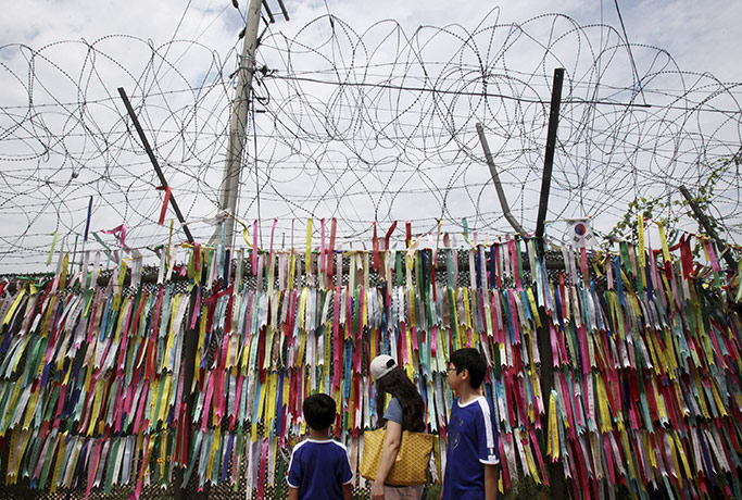 24 Hours: South Korean visitors read messages on ribbons at the Imjingak Pavilion