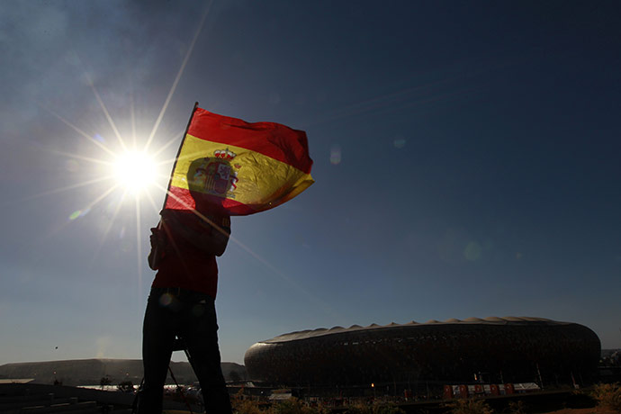 24 Hours: A Spain fan holds a Spanish flag before the World Cup final