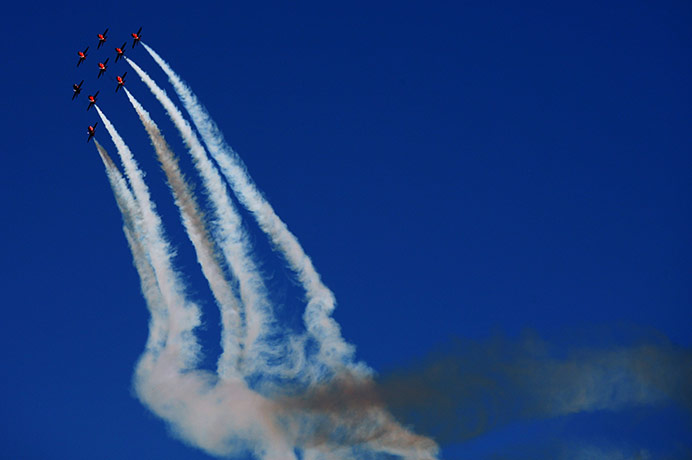 24 Hours: Red Arrows display team perform for the crowd before British Formula One