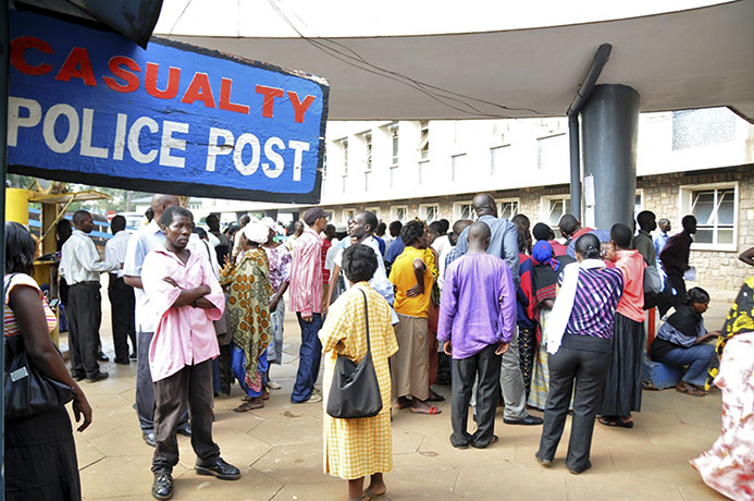 Ugandan Bombings: People gather outside Mulago Hospital casualty section following the blasts