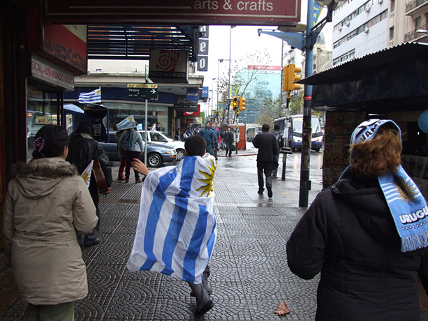 Fans' network: A young Uruguay fan wrapped in his team's flag
