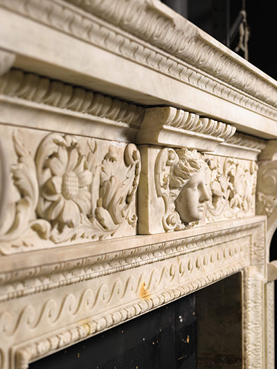 Chatsworth House auction: A detail of a George II carved white marble chimneypiece