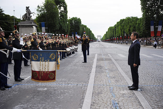 Bastille day: French President Nicolas Sarkozy listens to a military brass band