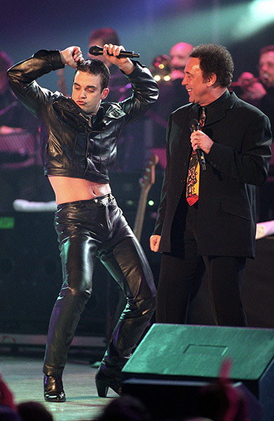 Take That: Singers Robbie Williams and Tom Jones duet at the 1998 Brit Awards