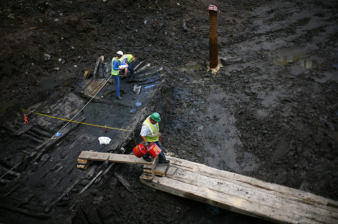 24 hours in pictures: New York, US: Workers examine remnants of an 18th-century ship