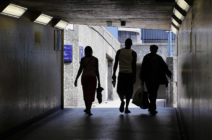 Week in Business: Pedestrians walk through a tunnel at the Elephant and Castle in London