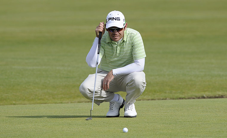 British Open Saturday: Louis Oosthuizen lines up a putt on the 1st