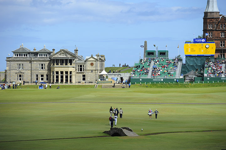 British Open Saturday: Early starters make their way go up the 18th hole