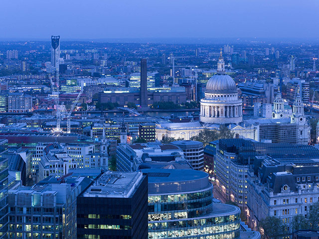 Strata: A view of the building at dusk