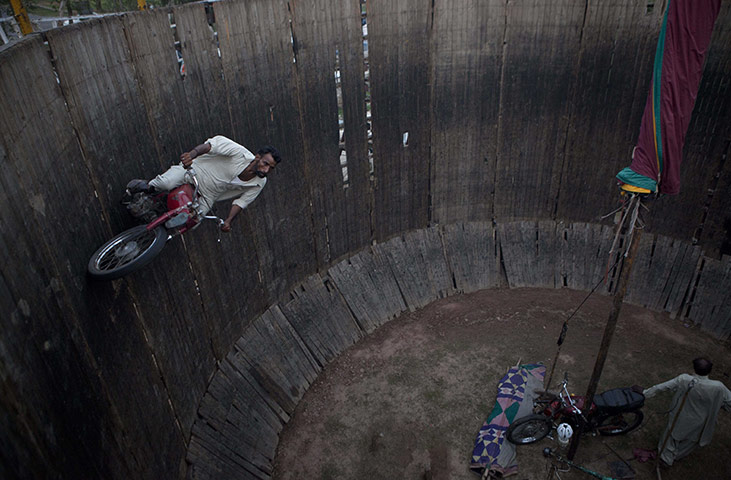 24 hours in pictures: Islamabad, Pakistan: Stunt rider Abdul Jabbar