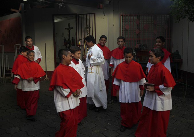 24 hours in pictures: Managua, Nicaragua: A priest and altar boys