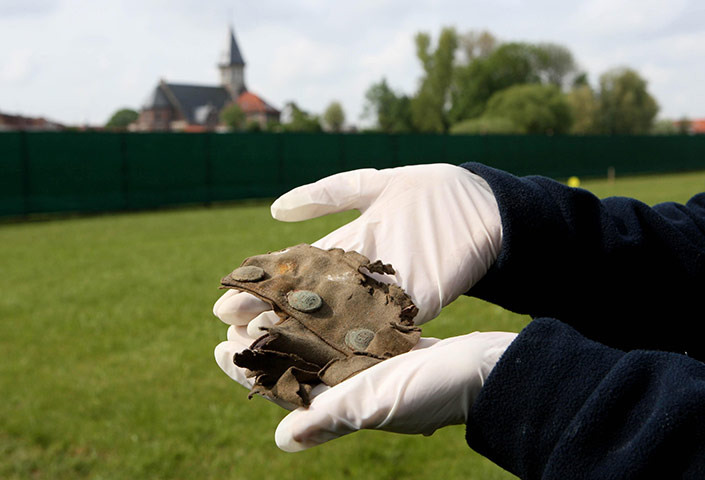 Fromelles: Kate Brady from Oxford Archaeology holds part of a First World War uniform 