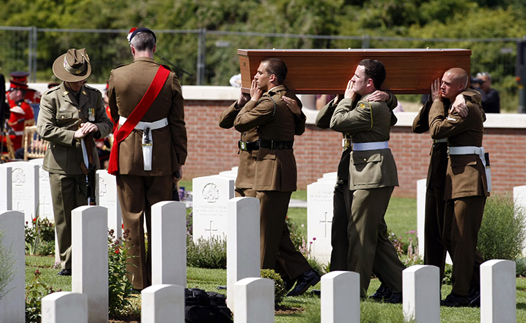 Fromelles: British and Australian soldiers carry the coffin of an unknown Australian