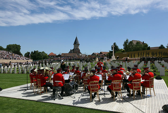 Fromelles: A military band plays during the burial of the final soldier