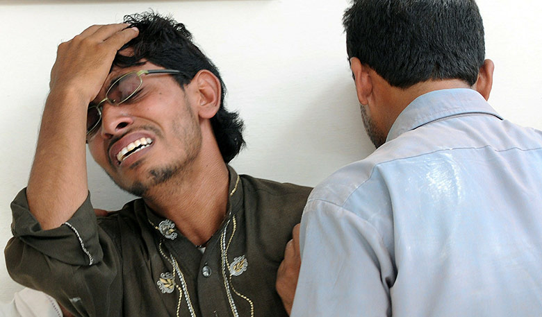 Lahore bombings: People mourn the death of a relative at a hospital in Lahore 