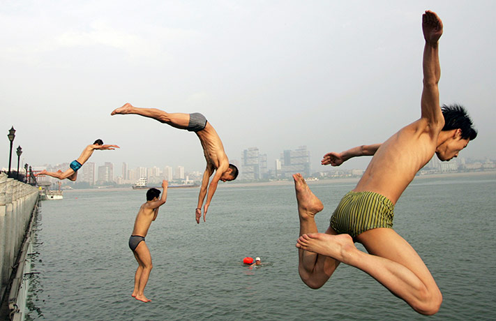 24 hours in pictures: Chinese men jump into Han River during a hot summer day in Wuhan