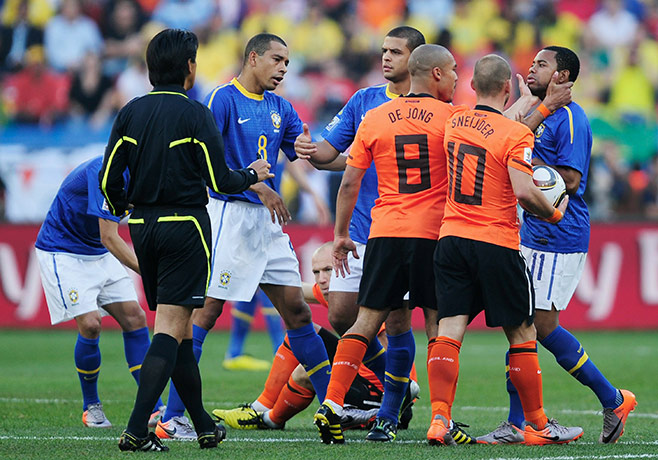 Netherlands v Brazil: Nigel De Jong and Wesley Sneijder grab Robinho 