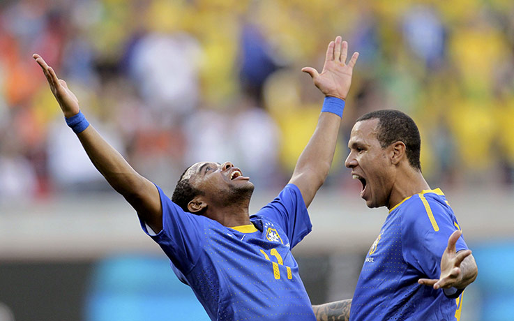 Netherlands v Brazil: Robinho celebrates with team mate Fabiano after scoring against Netherlands