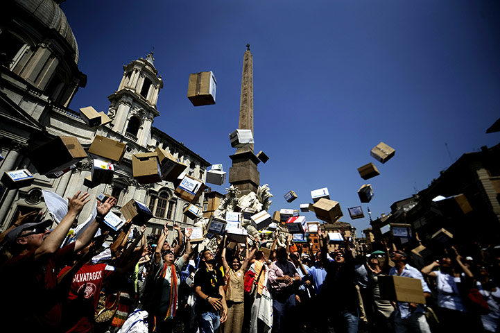 24 hours in pictures: Rome, Italy: Citizens throw empty boxes