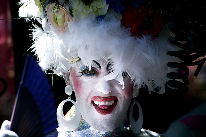 24 hours in pictures: Tilburg, Netherlands: A visitor takes part in Pink Monday at funfair