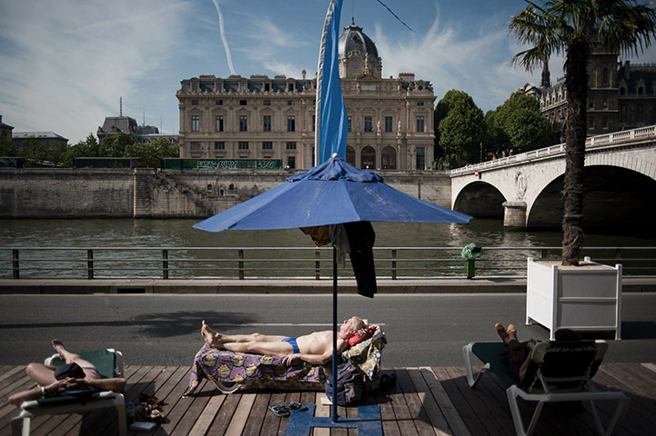 Paris Plage: People sunbathe on the opening day of Paris Plage