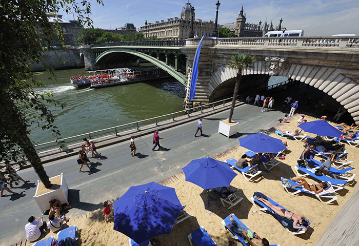 Paris Plage: People enjoy the sun as the Paris Plage opens