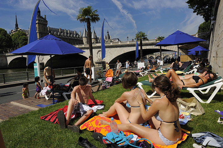 Paris Plage: People enjoy the sun as the Paris Plage opens